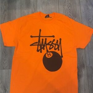 Stussy Bold Orange Tee with Black Graphic